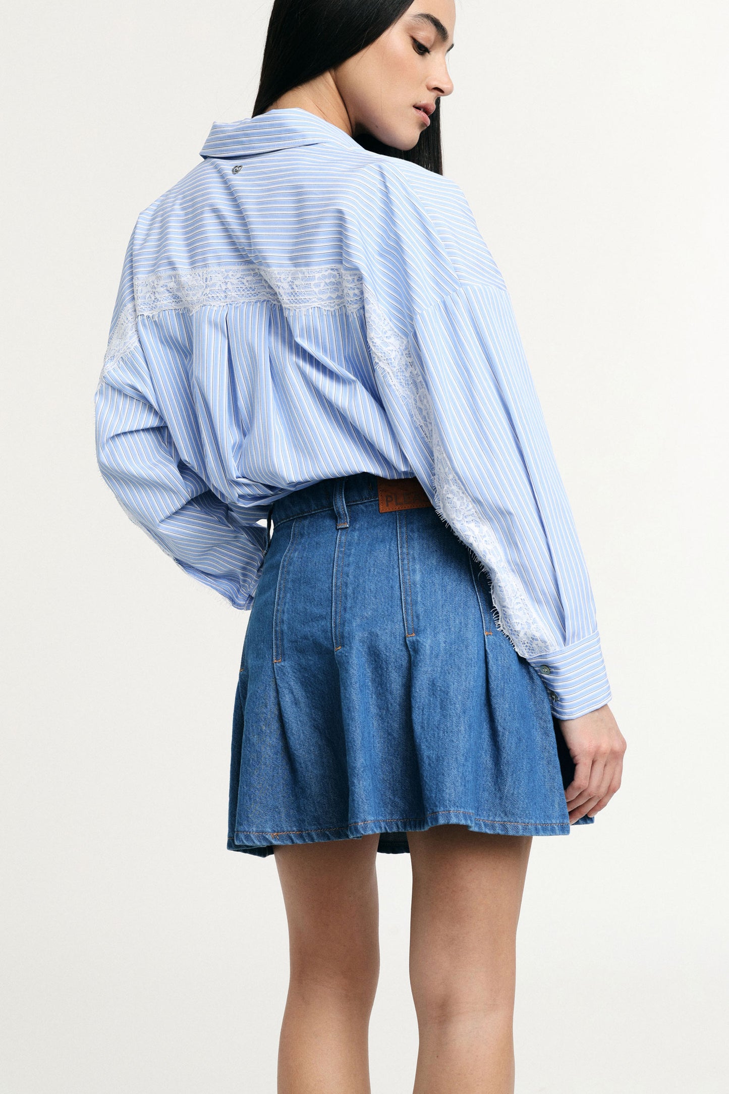 Denim miniskirt with front pockets and pleats