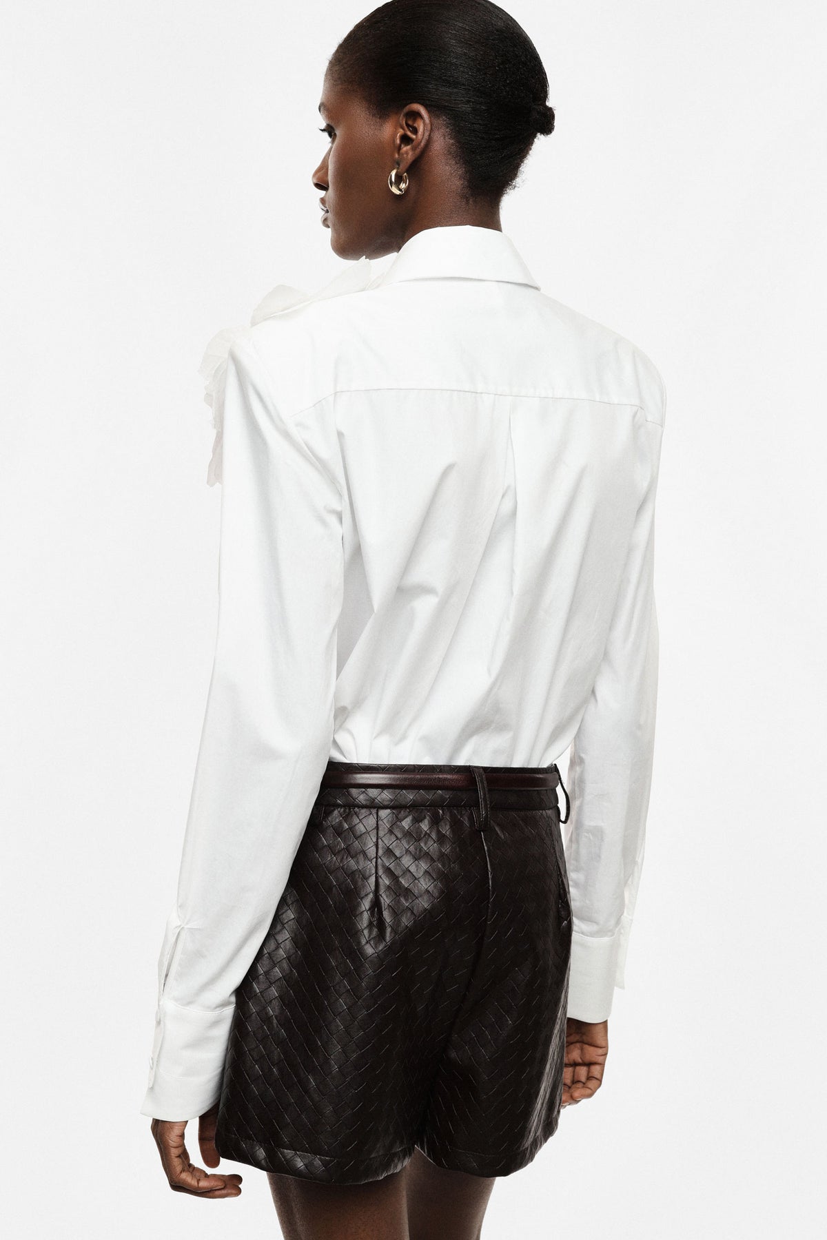 Shirt with flower appliqué and extended cuffs