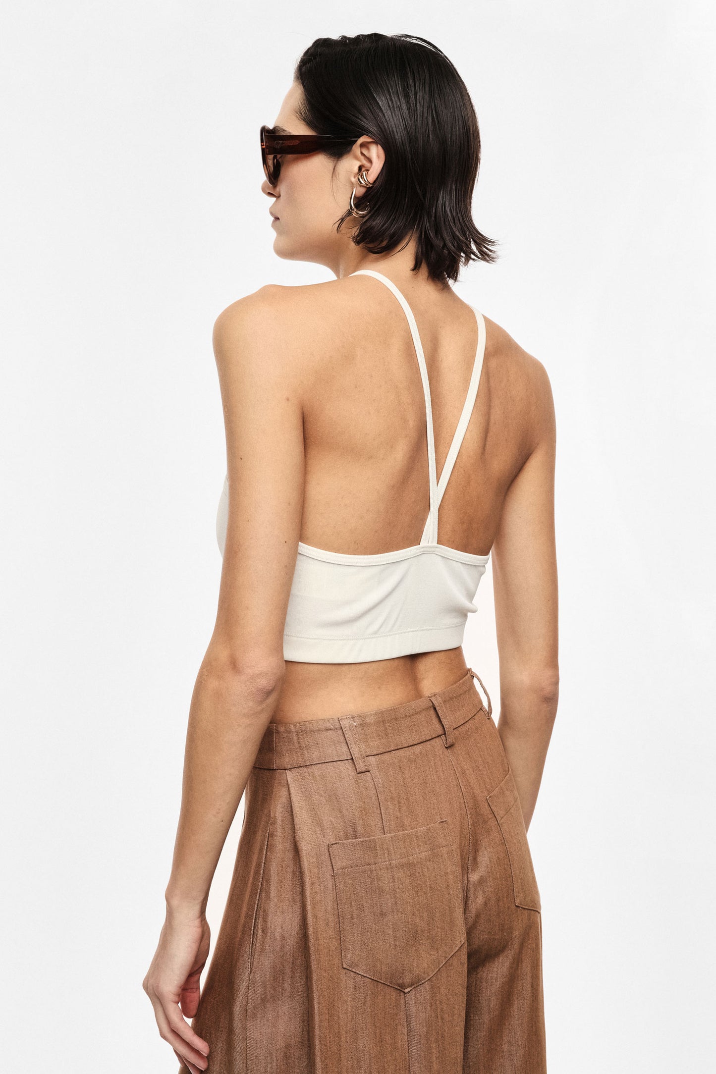 Cropped halter top with crossed straps