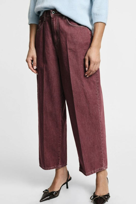 Tapered cropped jeans with central pleat