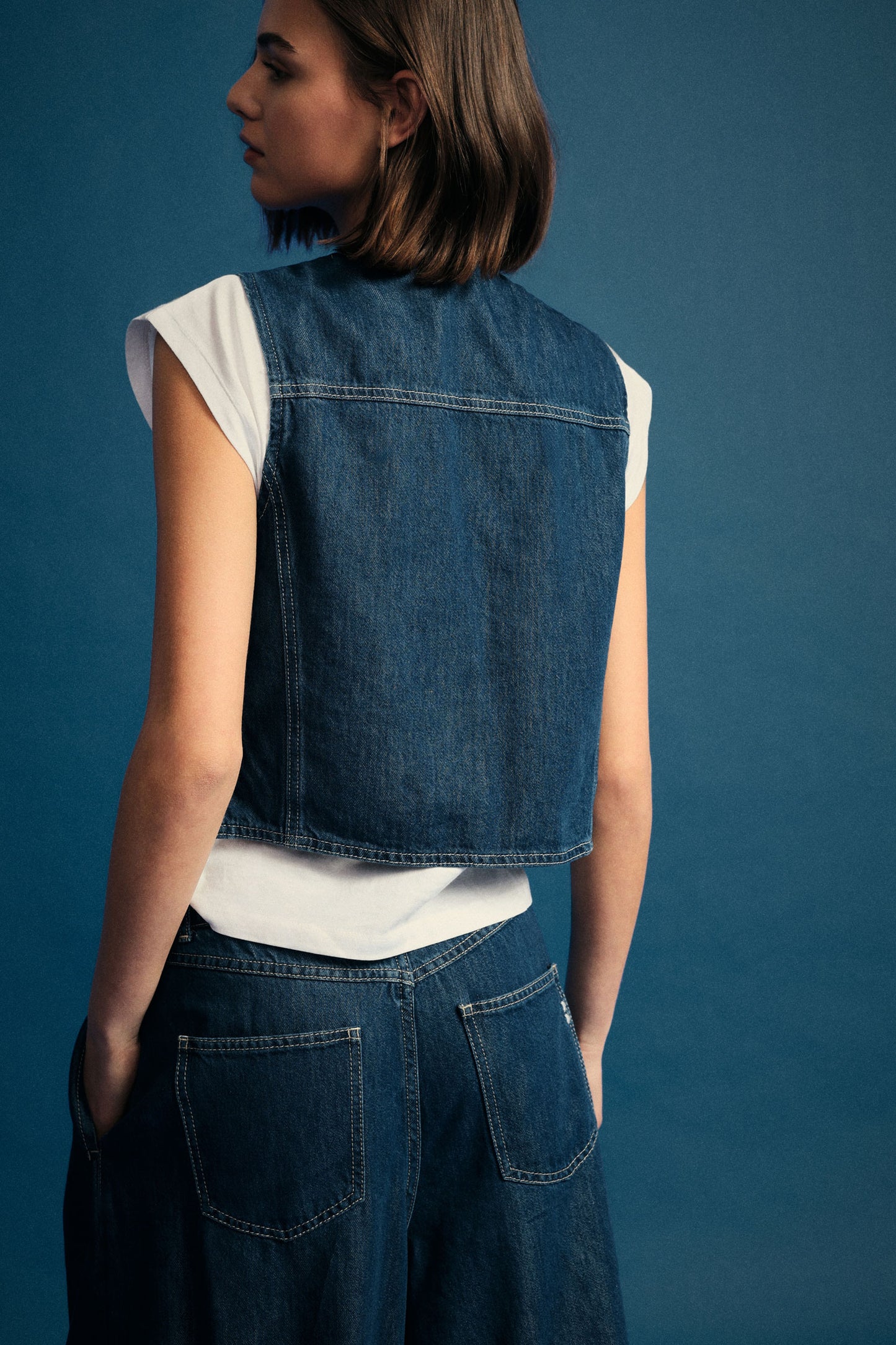 Denim vest with toggle closure