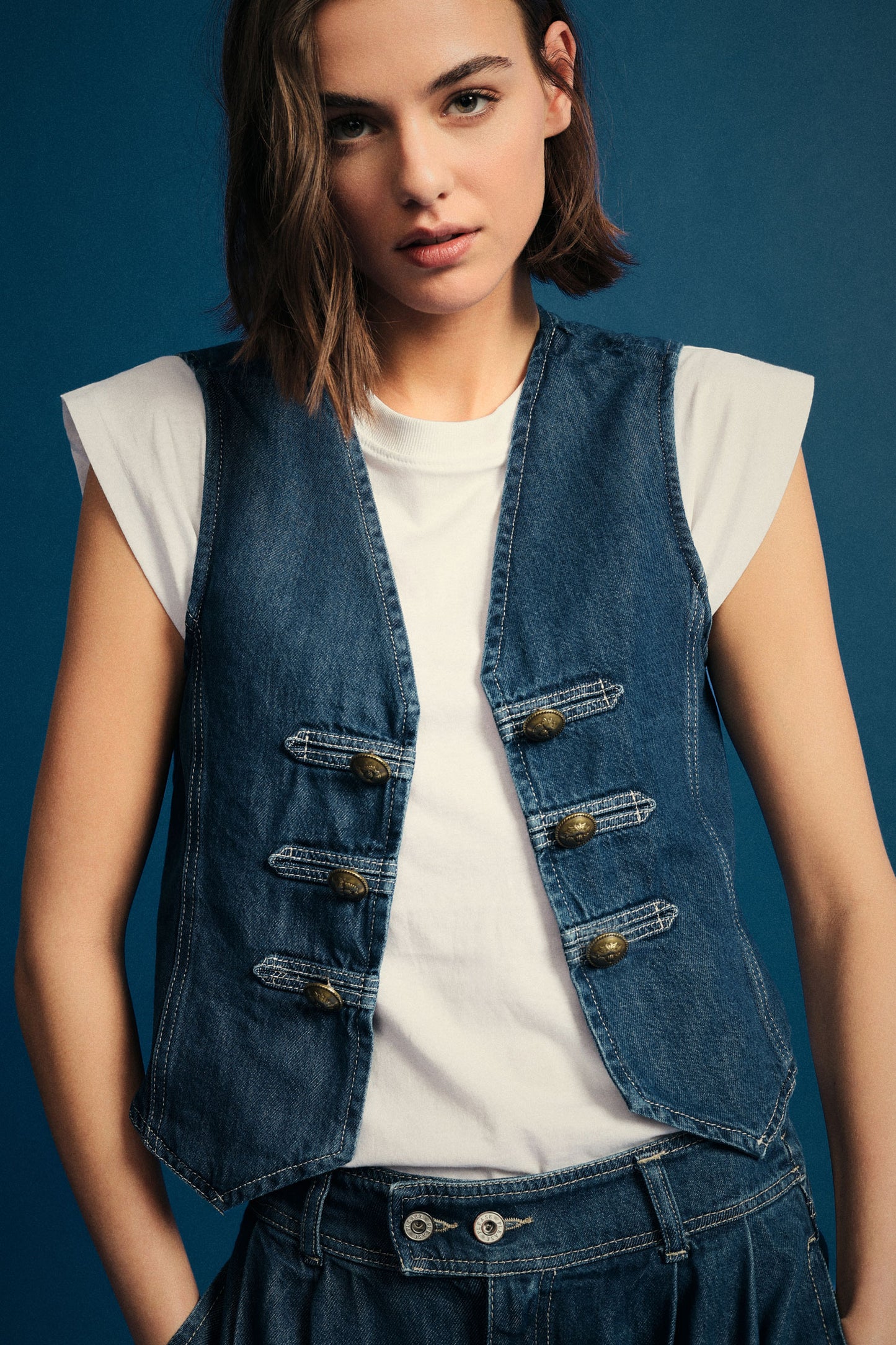 Denim vest with toggle closure